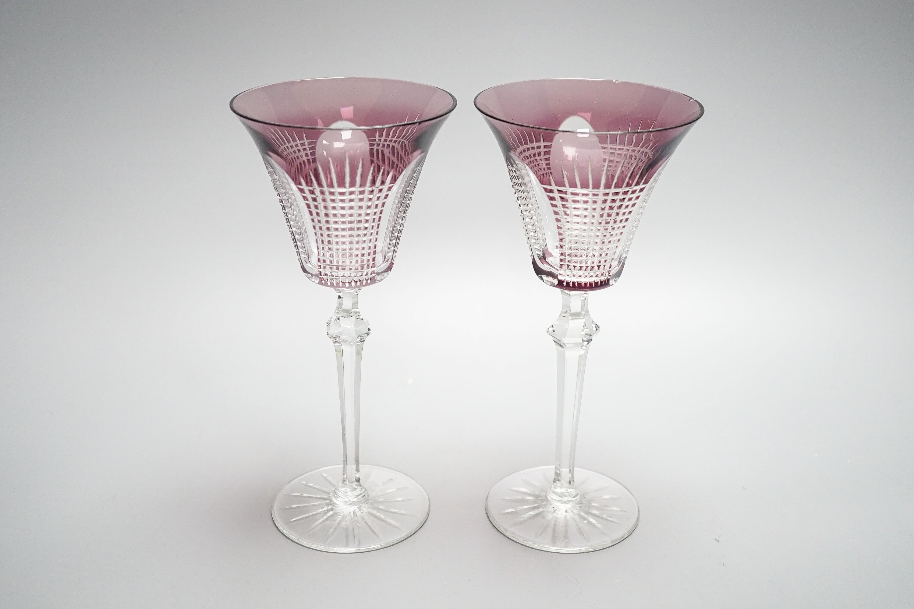 A set of fourteen cut amethyst flashed wine glasses, 21cm